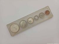 Front view of all six coins in holder, wildlife reverses visible