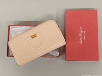 Wallet in open box with lid alongside