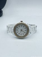 Front view showing full watch, bezel, bracelet