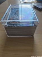 Side view of card stack inside clear plastic box