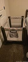 Assembled Graco Pack 'n Play showing mesh sides and patterned trim