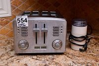 Cuisinart toaster and coffee grinder on countertop showing overall condition and size comparison.
