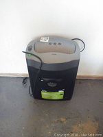 Photo of Royal paper shredder showing front view, power cord, and indicator lights.