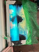 Front view showing seascape print, mirror border and power cord