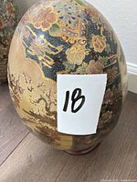 Front view of hand-painted Satsuma-style vase showing floral, bird and gold details