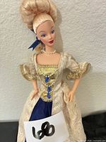 Full front view of Barbie doll in gown