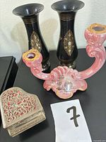 Overall view of both vases, pink candelabra, and metal trinket box
