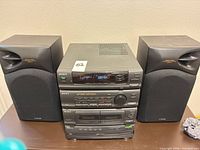 Front view of main unit flanked by both speakers
