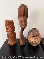 Front view of all three wooden figurines