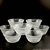 Front view showing all eight textured crystal bowls