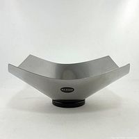 Front view of Alessi Lobo stainless steel fruit bowl showing form and Alessi sticker