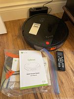 Kyvol E20 robot vacuum with charging dock, remote, manual, bagged side brushes