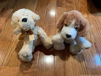 Front view of both Shining Stars plush dogs