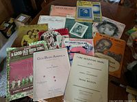 Group shot of all sheet music titles spread on table