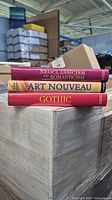 Spine view of all three books stacked