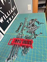 Overall view of rack set and loose wrenches on cutting mat