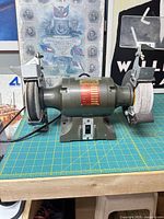 front view of Busy Bee SL-150W bench grinder with cloth wheels, eye shields, tool rests