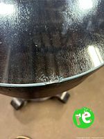 Chipped edge of glass top on table