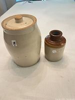 Front view of both stoneware pieces showing overall form and color