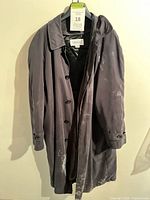 Front view of Joseph & Feiss overcoat showing buttons, collar, pockets and white residue marks