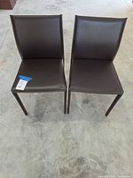 Front view of both chairs showing upholstery and overall condition