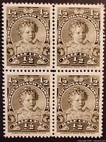 Front view of four-stamp block showing full design and perforations