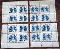 All four corner blocks of stamps displayed together