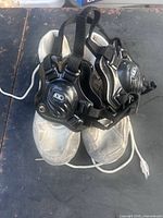 Shoes front view with headgear placed on top