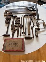 group view of all antique tools and cigar box