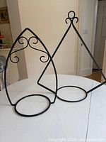 Both wrought iron plant hangers full view