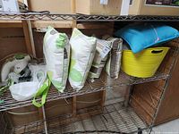 All five pillows on wire shelf