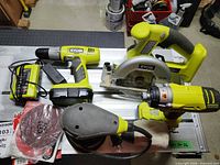 Group shot of all Ryobi tools, batteries, charger and accessories
