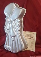 Holly Hobbie cake pan front view with booklet