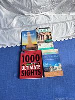 All four paperback travel books laid out face up