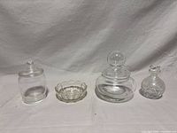 Four clear glass pieces lined up