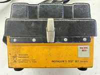 Front of closed test set showing Western Progress branding, Pacific Bell label and latch