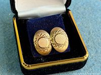 Pair of 9K yellow gold oval earrings in display box