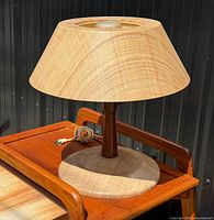 Full view of table lamp on teak side table
