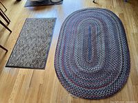 Both rugs shown on hardwood floor for size and pattern reference