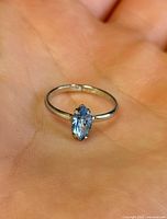 ring front view showing marquise stone and band