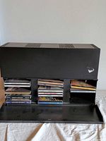 Front view of black Case Logic CD holder with open door showing CD rows