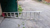 Ladder folded flat showing full length and aluminum construction