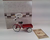 Model tricycle with box and booklet visible