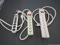 Three power strips laid out side by side
