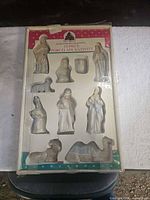 Boxed 10-piece porcelain nativity set overall view