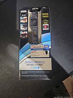 Front of boxed VuPoint Magic Wand IV portable scanner showing model ST470 and features