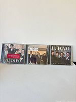 Front view of three Il Divo CDs side by side