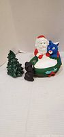 Front view of Santa dish, tree and black figurine