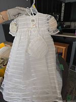 Front view of dress with purse attached, tag visible