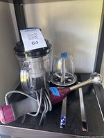 Complete set on shelf: chopper bowl, blade cup, immersion shaft